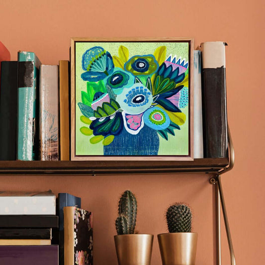 Cool Garden origina painting by Kirsten Katz on a shelf with books and plants against an orange wall