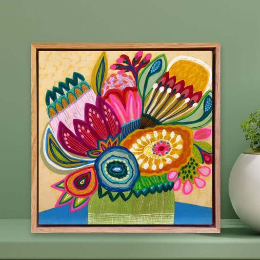 Original modern painting by Kirsten Katz in a wooden frame on a green wall with two potted plants.