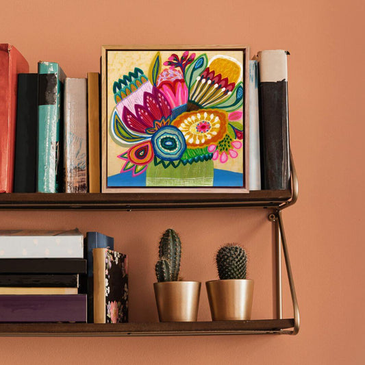 Original modern painting by Kirsten Katz on a shelf with books and cacti against an orange wall