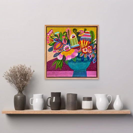 Colorful abstract painting on a wall above a shelf with decorative vases.