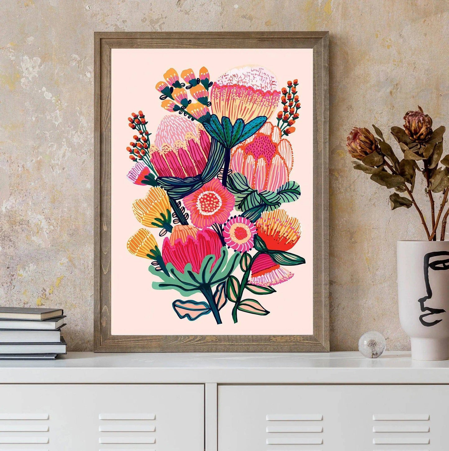 Flowers of Oz botanical art print displayed above a console table showing size and scale