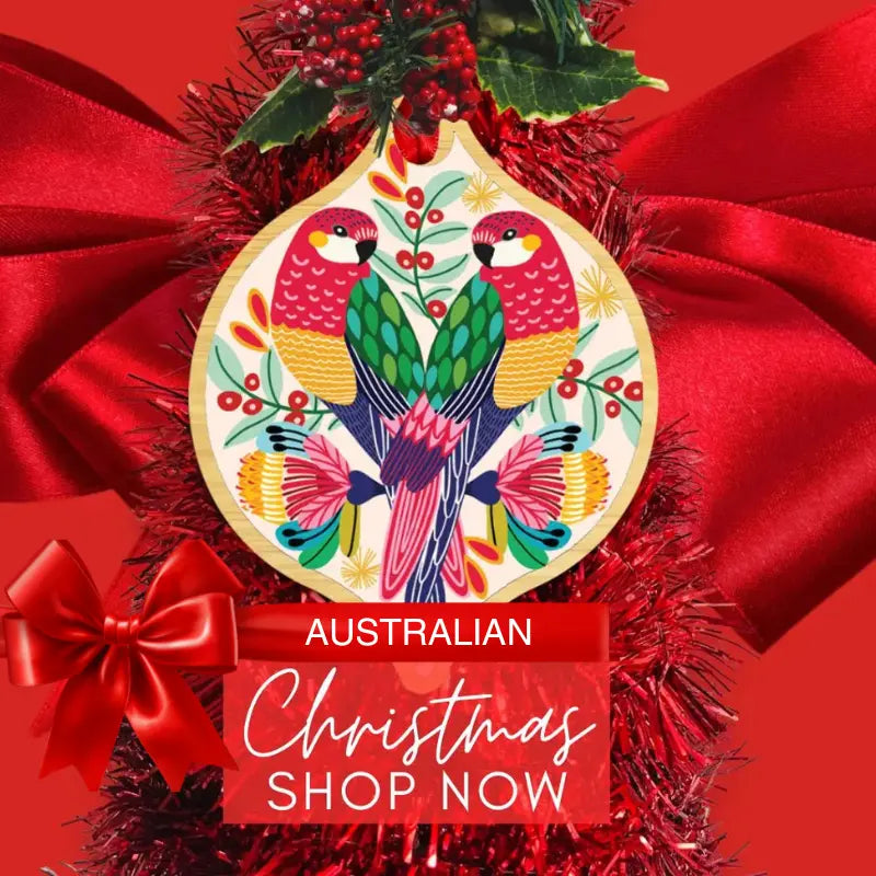wooden christmas ornament with Australain rosella birds and a red baclgorund with a caption that says Save 25% Christmas shop now