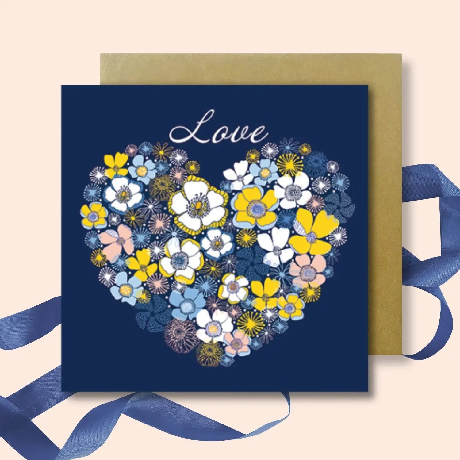 blue card with a heart made of flowers with the word love