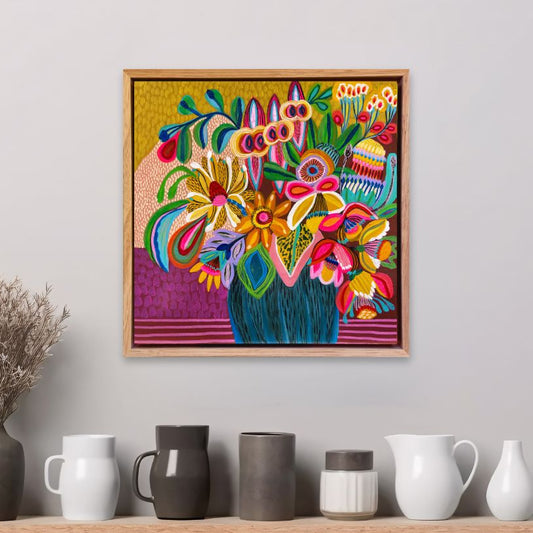 Abundant Beauty original painting by Kirsten Katz, framed on a wall above a shelf with decorative vases.