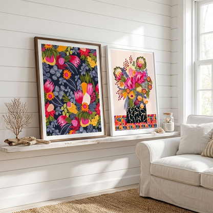 Kirsten Katz botanical print set, Birthday Bouquet with pink proteas in a patterned vase and White Protea & Bush Flowers on navy