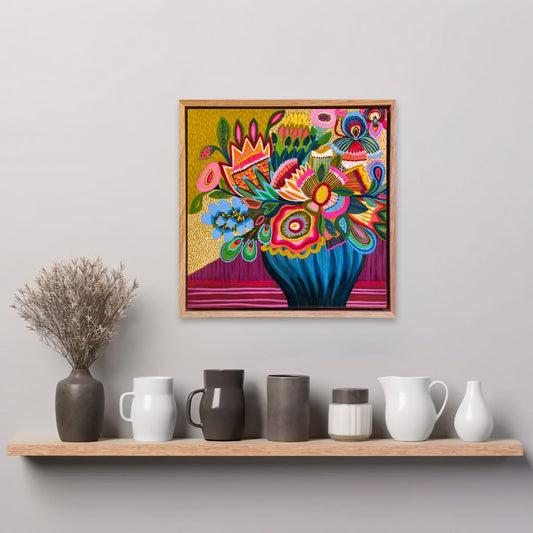 Colorful floral artwork on a wall above a shelf with various ceramic items.