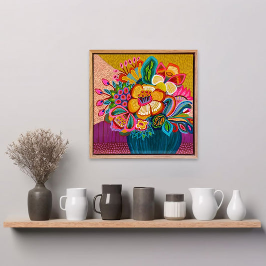 Colorful floral artwork on a wall above a shelf with decorative vases.