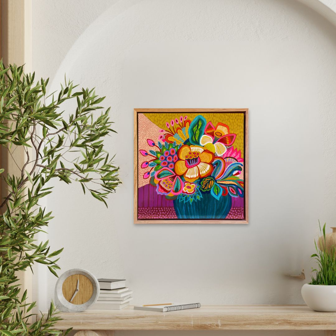 Colorful floral painting on a wall with a wooden shelf below containing books and a clock.