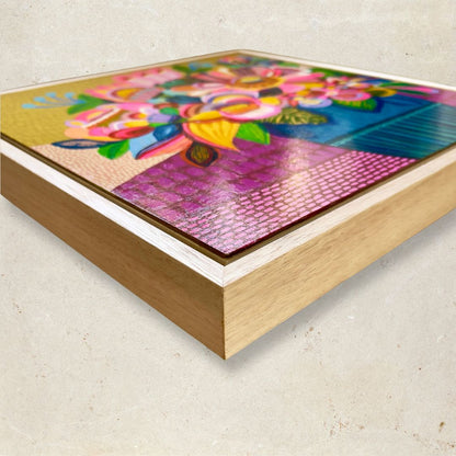 Colorful abstract artwork in a wooden frame on a light background