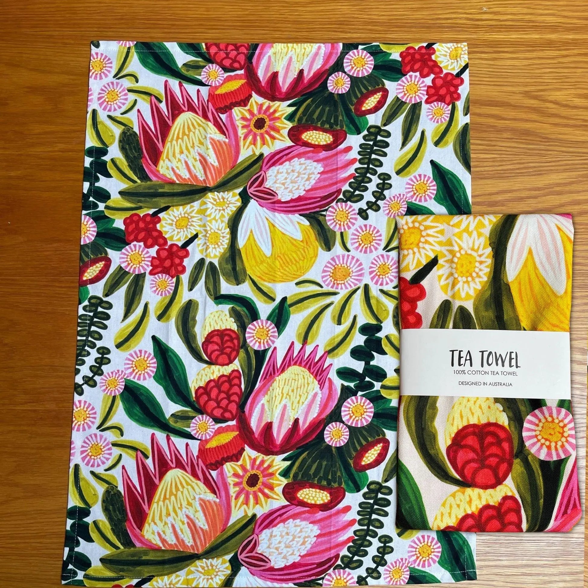 Festive proteas botanical print tea towel by Kirsten Katz